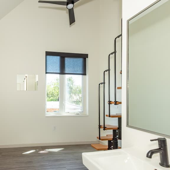 a bathroom with a window and a sink at society 62 apartments, portland 97213