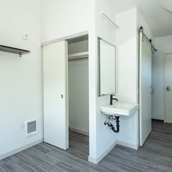 a bathroom with a sink and mirror at society 62 apartments, portland, or