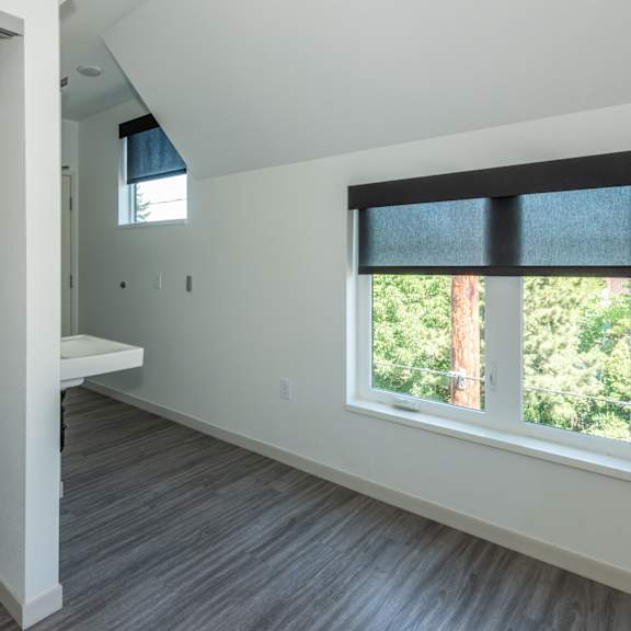 a room with a window and a bench. at society 62 apartments, portland, or, 97213