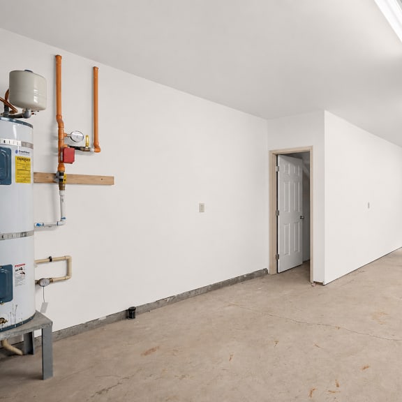 a large garage with white walls and a door