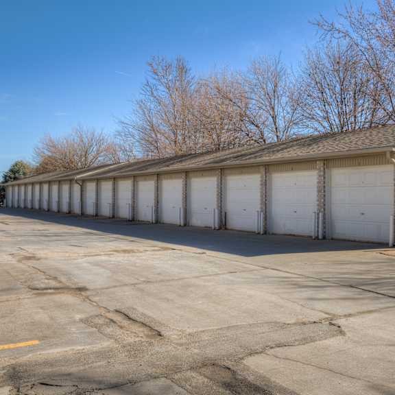 a long building with a garage door is in the foreground.