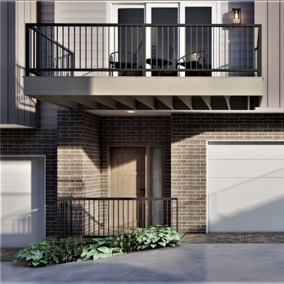 a modern house with a balcony and a garage.
