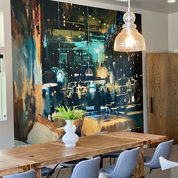 a dining room with a large table and chairs.