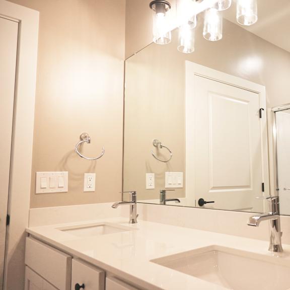 a bathroom with a sink and mirror.