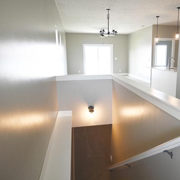 a bathroom with a large mirror and a window.