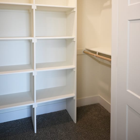 empty white shelves in a room.