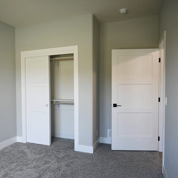 a room with two doors, one of which is open.