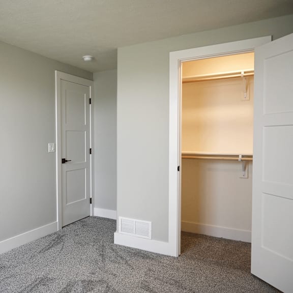 a room with a white door and a window.