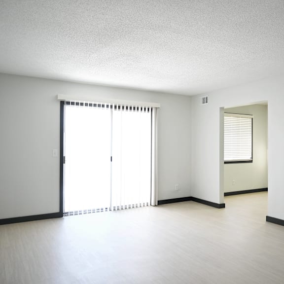 a room with a sliding door and a window.