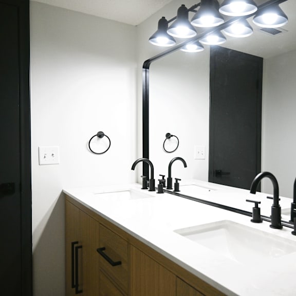 a bathroom sink with a mirror above it.
