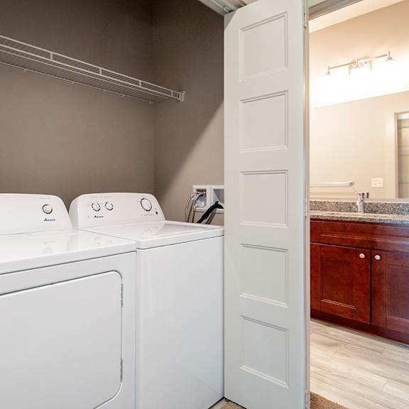 a white washer and dryer in a laundry room.