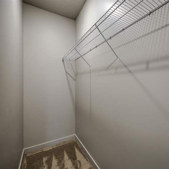 a metal shelf is mounted on the wall.