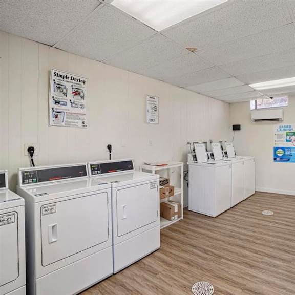 a laundromat with washers and dryers and a counter selling detergent.