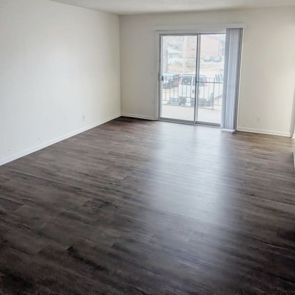 living room with wood style flooring and a sliding glass door at northbrook apartments