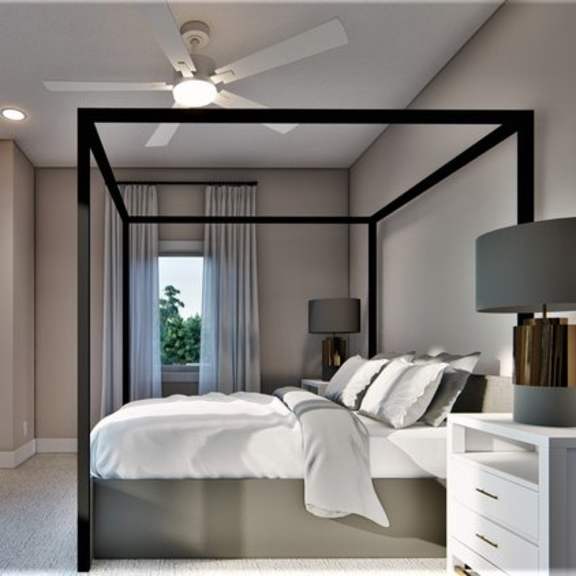 a bedroom with a bed, nightstand, and window.