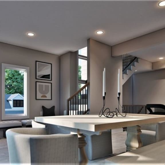 a modern living room with a staircase and a dining area.