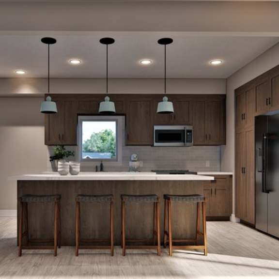 a modern kitchen with a bar area and a staircase.