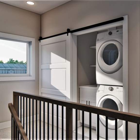 a washing machine is installed in a laundry room.