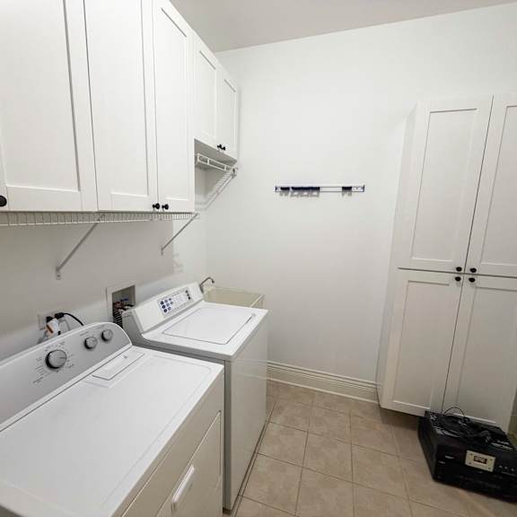 a small laundry room with a washer and dryer.