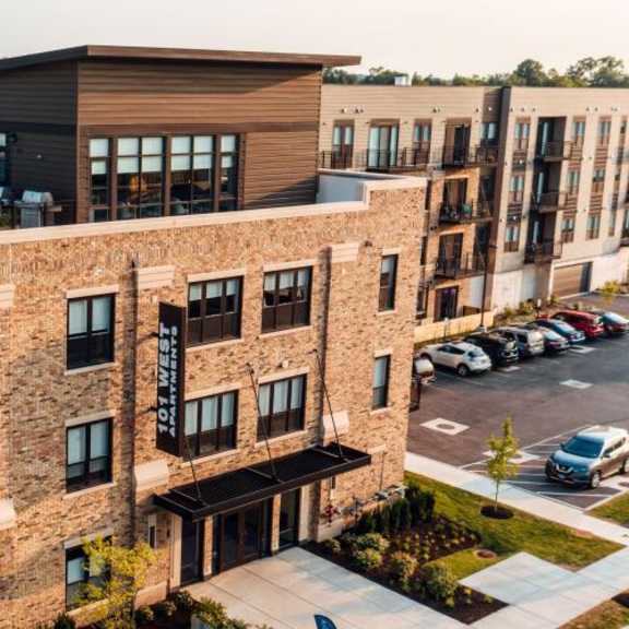 an aerial view of a building with cars parked in a parking lot at barrington 101, barrington, il 60010