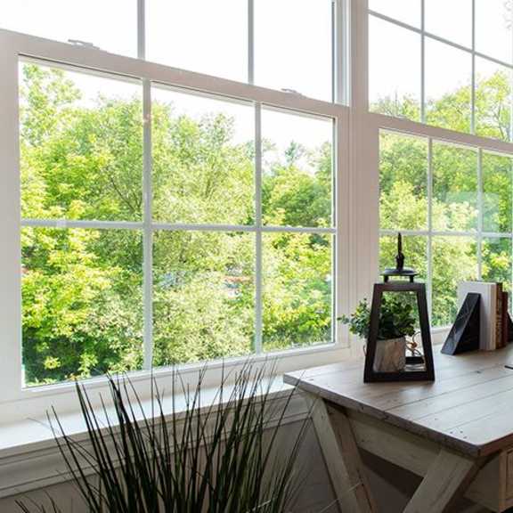 a room with a desk and a large window at countryside townhomes, countryside, il 60525