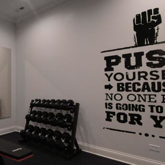 a gym with weights and a mirror on the wall  at tripp 4321, chicago, il