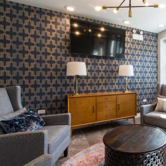 a living room with couches and chairs and a tv  at kedzie 4447, chicago, illinois