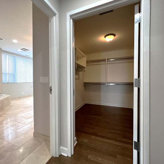 a view of a bathroom and a living room from a doorway