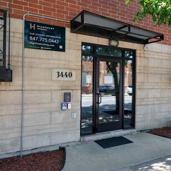 the front of a building with a sign that reads