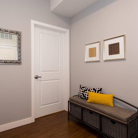 a living room with a couch and a door
