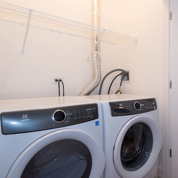 a laundry room with a washing machine and a dryer