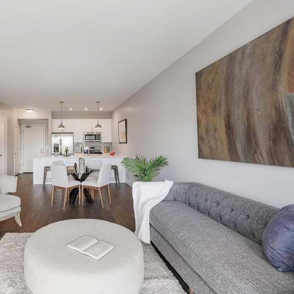 a living room with a couch and a table at barrington 101, barrington, il