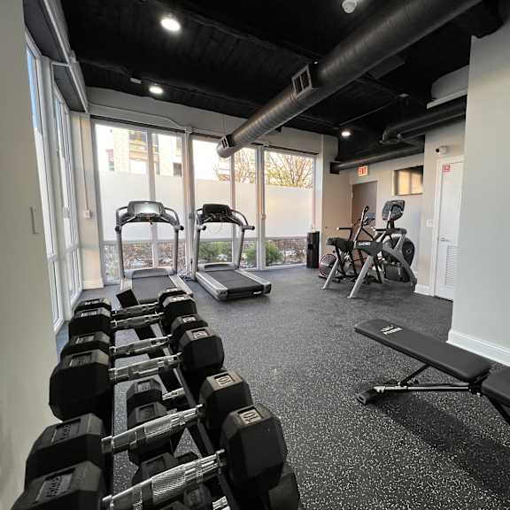 a gym with free weights and machines 