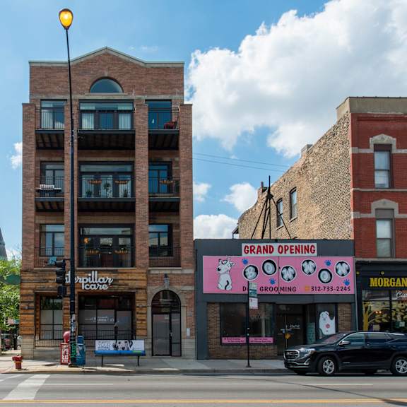 a brick building on the corner of a city street at west chicago 1701, chicago