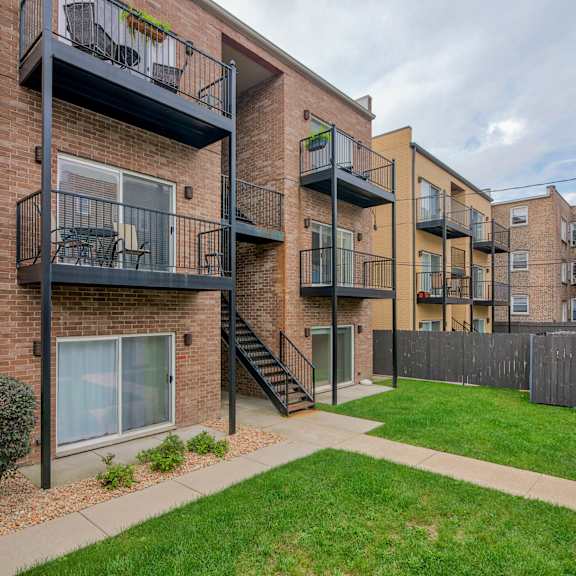 our apartments offer a spacious courtyard with grass at montrose 3634, chicago, il