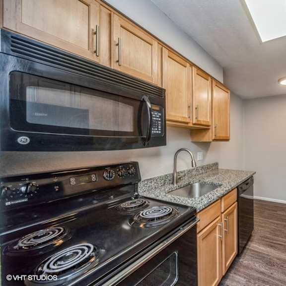 plenty of counter space and rich wood-like flooring at 1190 s bellaire st in denver, co