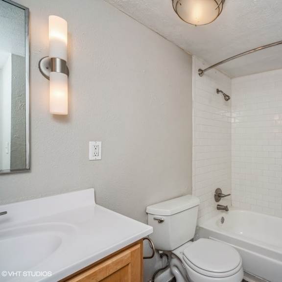 updated bathroom with tiled shower at 1190 s bellaire st in denver, co