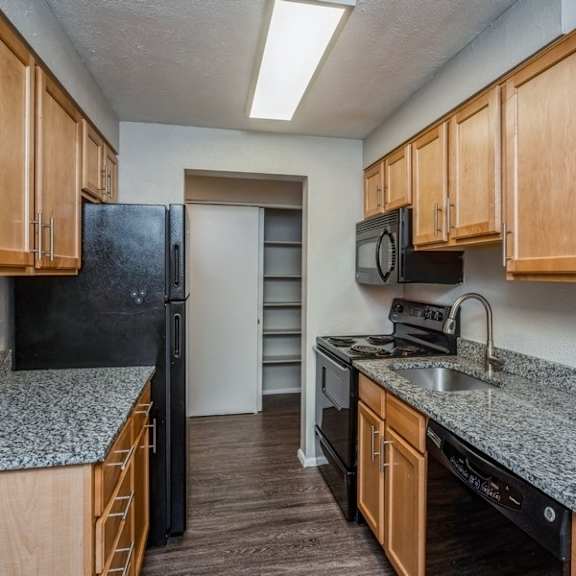 spacious kitchen with granite counter tops at 1190 s bellaire st in denver, co