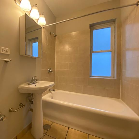 bathroom with full size tub - charlie chaplin one bedroom