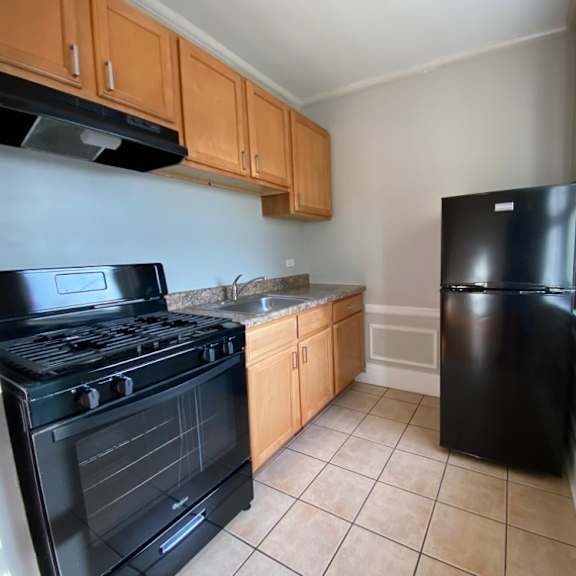 kitchen with all black appliances - george spoor studio