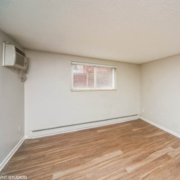 empty, customizable living room at 136 s penn in denver, co