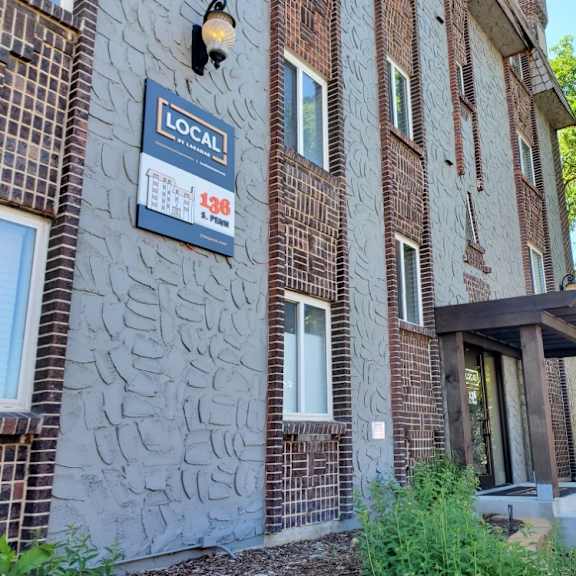 well maintained landscaping and exterior building at 136 s penn in denver, co