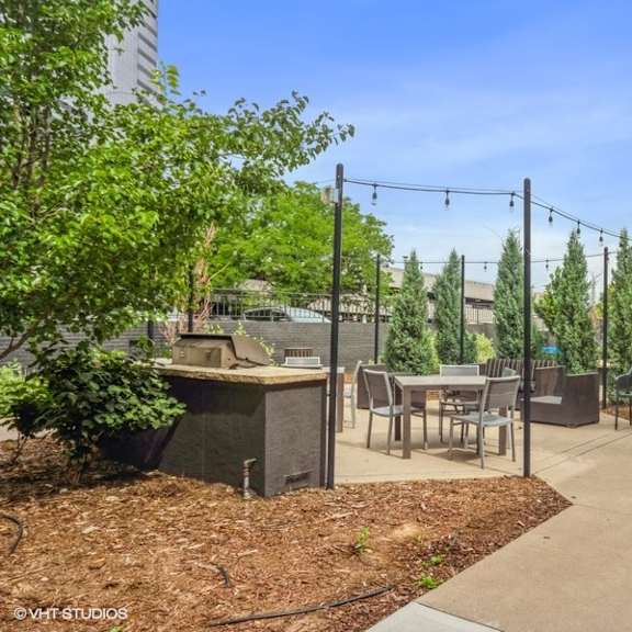 plenty of seating on the community patio to enjoy the denver sunshine at 1190 s bellaire st in denver, co