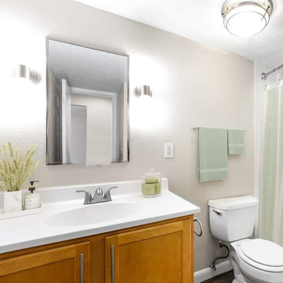 fresh, clean, and functional—this bathroom brings together classic finishes with modern simplicity at 1190 s bellaire st in denver, co