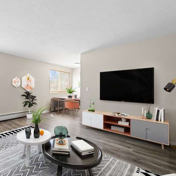 this expansive living room offers panoramic views, modern floors, and plenty of space to relax or entertain at 1190 s bellaire st in denver, co