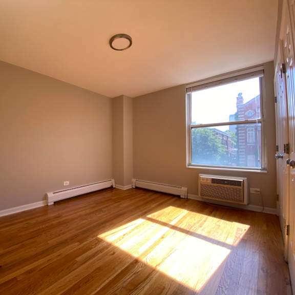 sunny bedroom with hardwood floors - one bedroom