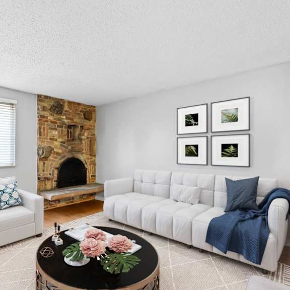 your cozy corner of the city. this light-filled living room features a charming stone fireplace and modern design details that make relaxing feel effortless at 136 s penn in denver, co