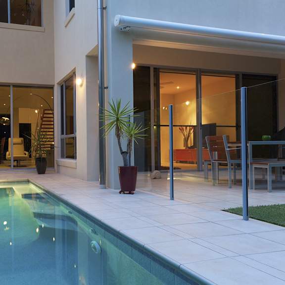 a swimming pool in the backyard of a house