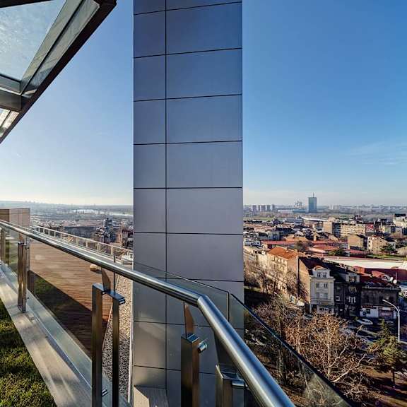 a view of a city from a balcony of a building