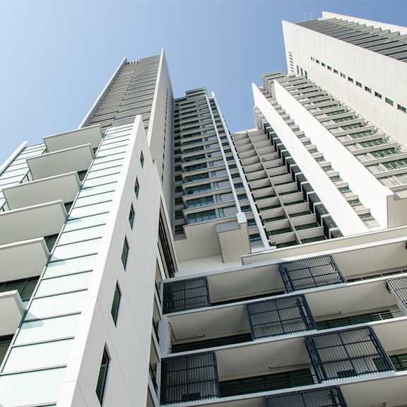 a tall building with a blue sky in the background